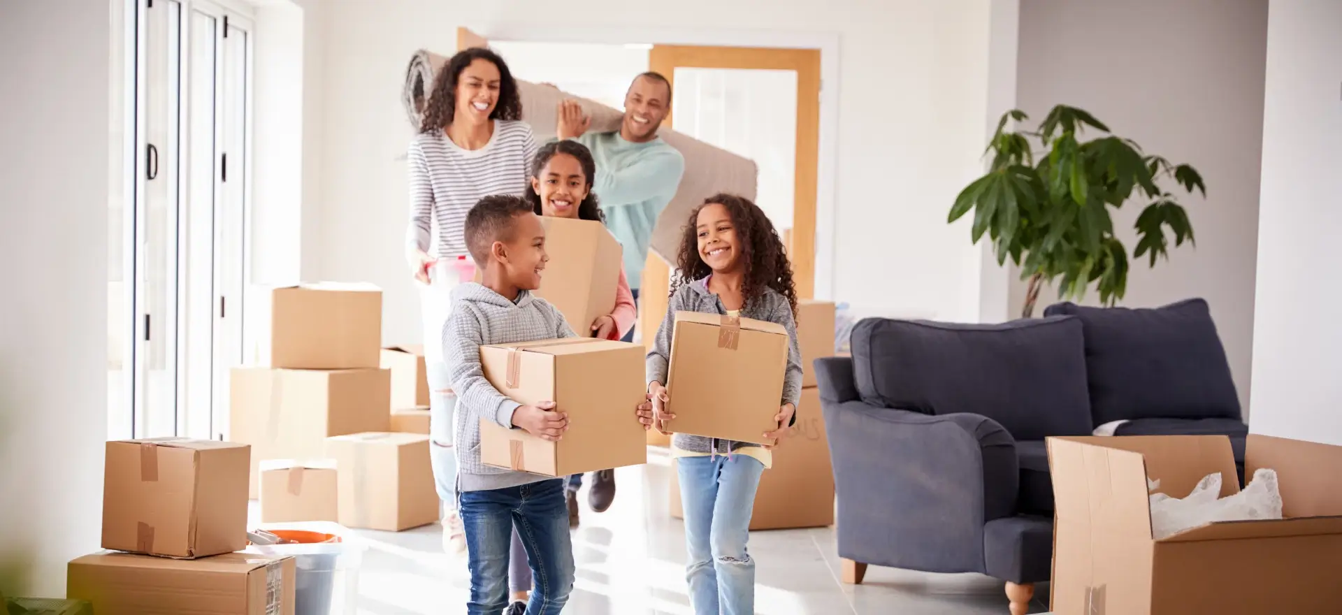 Happy family moving in to their new home thanks to OC Home Loans and Finance